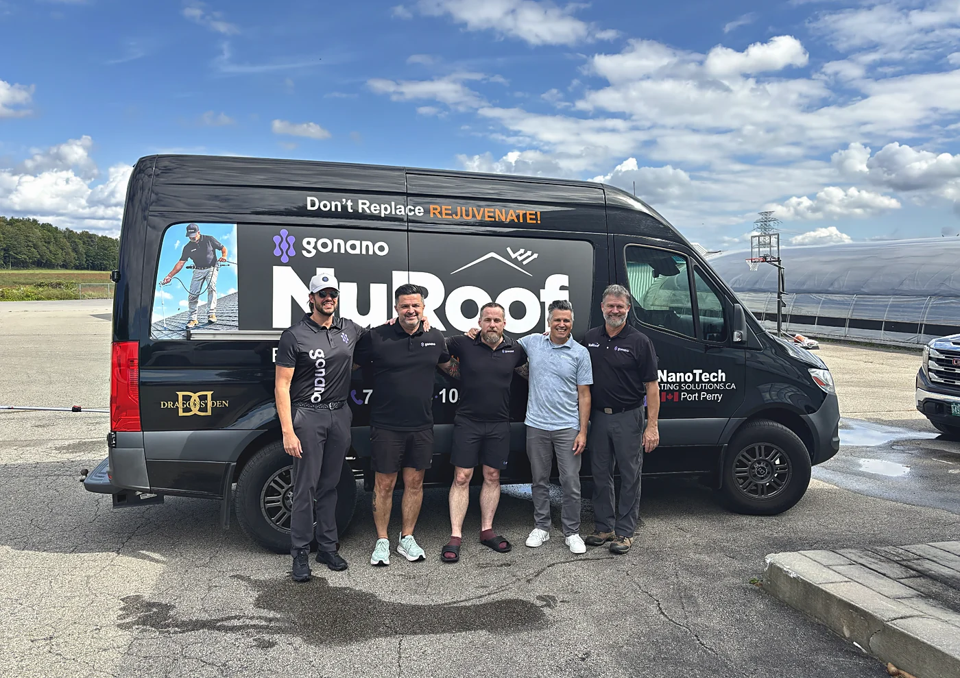 A group of five in gonano shirts standing in front of the NuRoof Sprinter van.